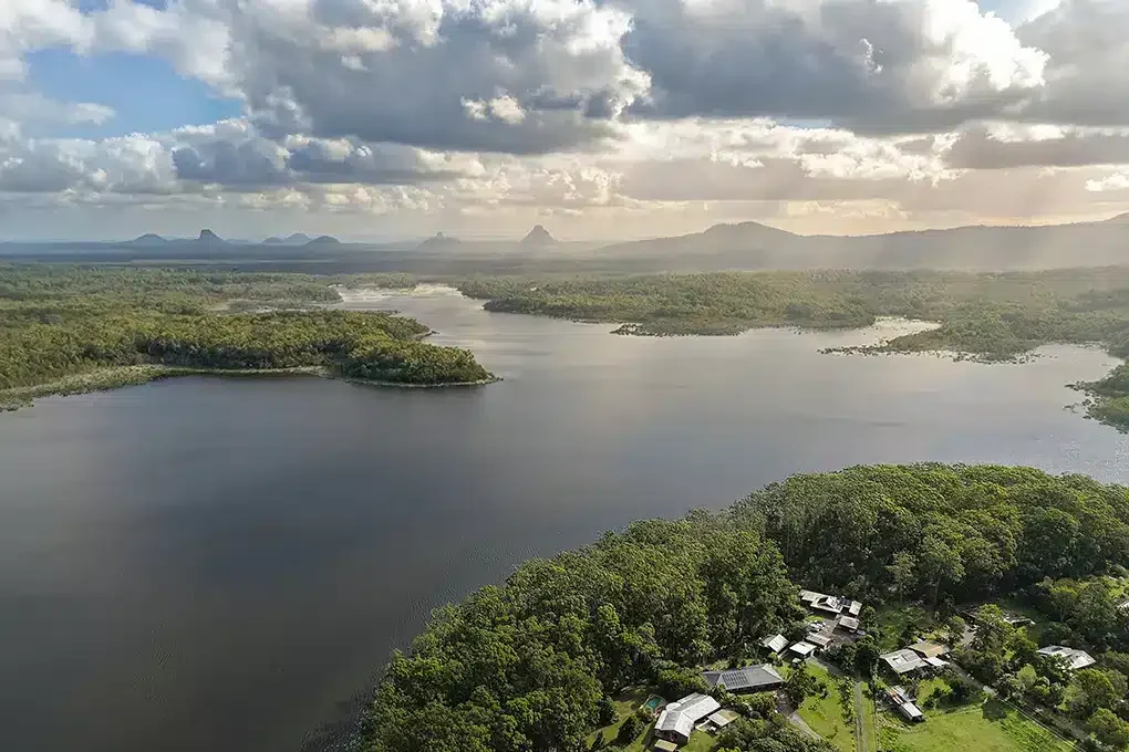 Drone laws Queensland compliance for Sunshine Coast real estate aerial photography overlooking hinterland lake