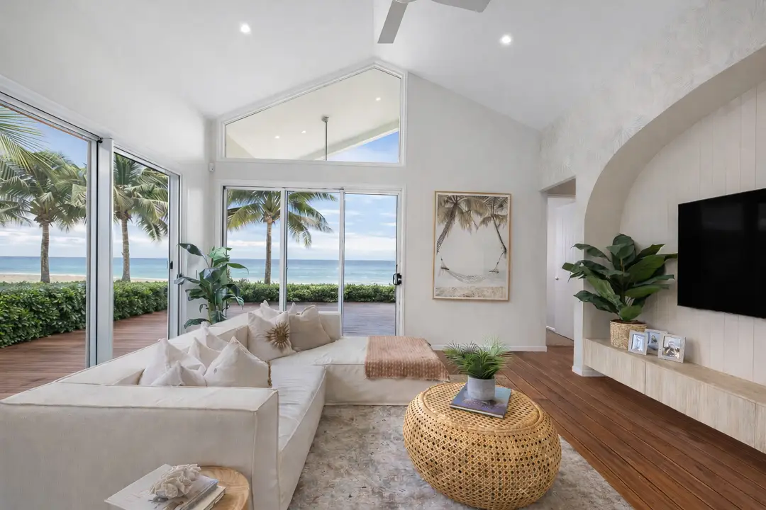 Real estate photography Sunshine Coast — luxury living room with ocean views and neutral coastal styling by Studio Rob
