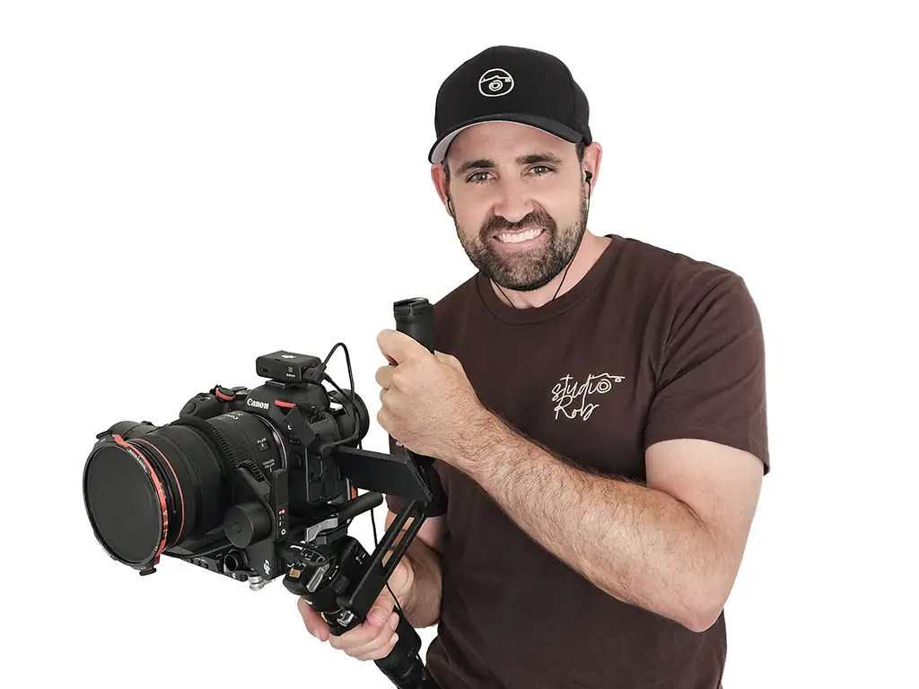 Studio Rob photographer holding a stabilized handheld camera rig, highlighting commercial-grade real estate photography gear