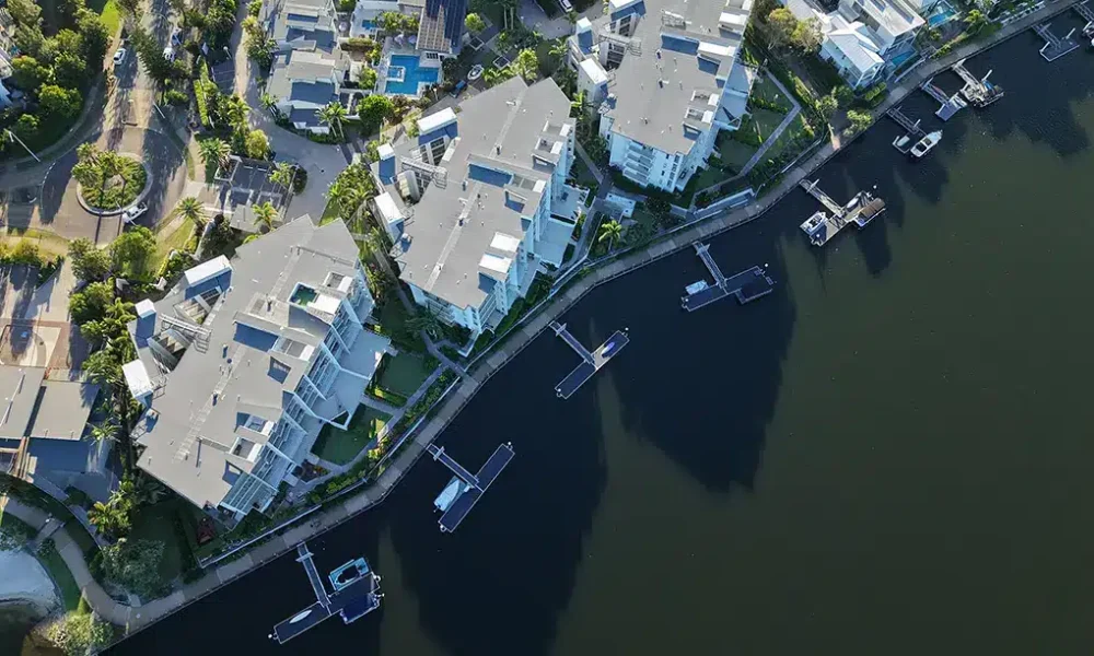 Drone photography Sunshine Coast — aerial view of waterfront suburb with canals and river channels by Studio Rob